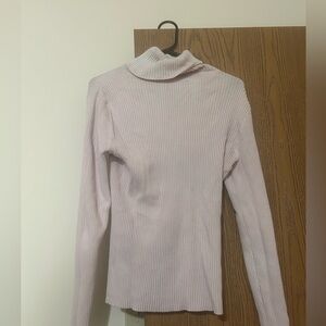 Women’s pink turtleneck sweater